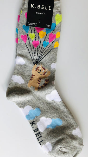 K Bell brand light grey crew socks with super cute cat floating through clouds with multicoloured heart shaped balloons 