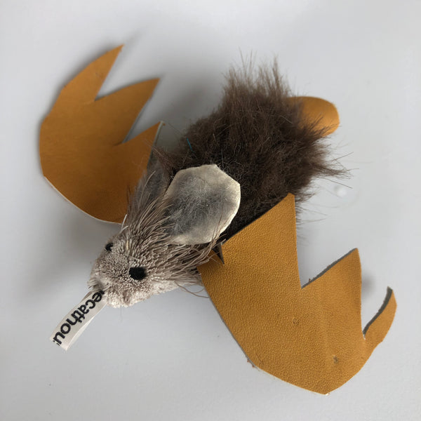 fur cat toy with brown leather bat wings