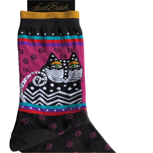 black sock with iconic Laurel Burch swirls in pink on the foot, with super cute black & white cat with green eyes and gold stripe at the cuff, your new favourite socks