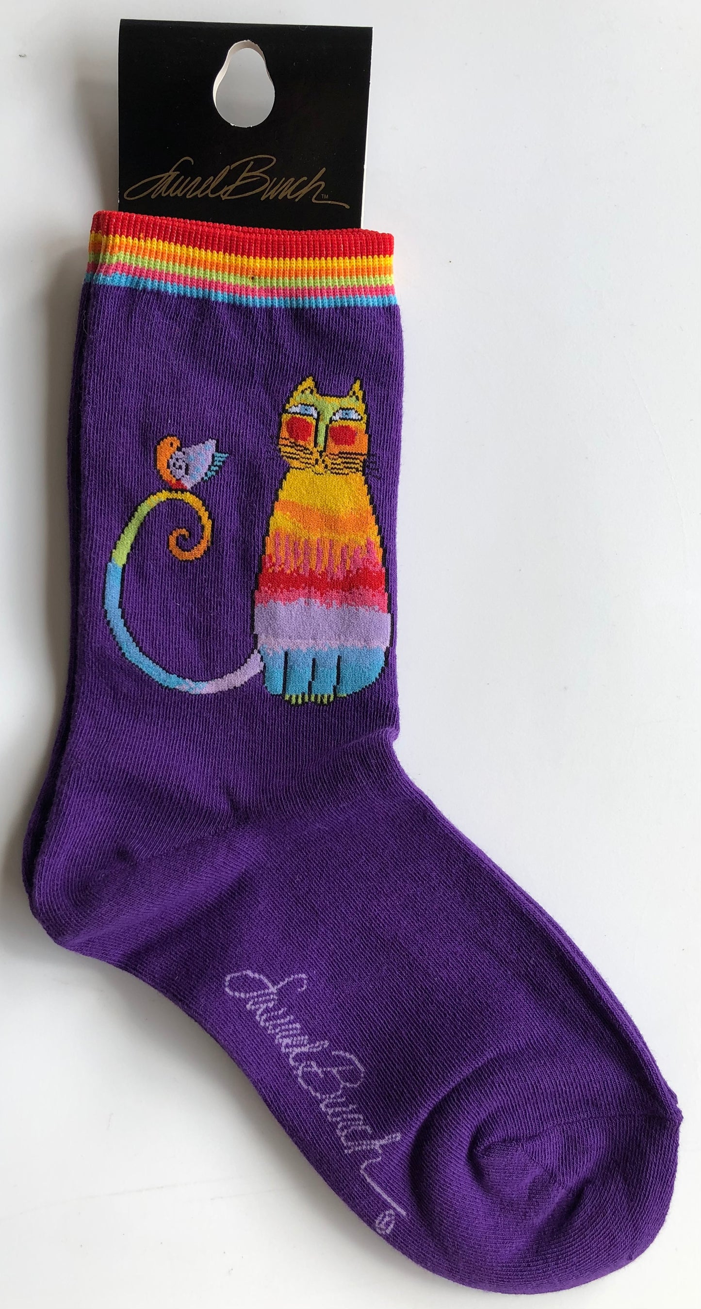 iconic Laurel Burch with violet sock, rainbow cuff and rainbow cat with bird sitting on its tail