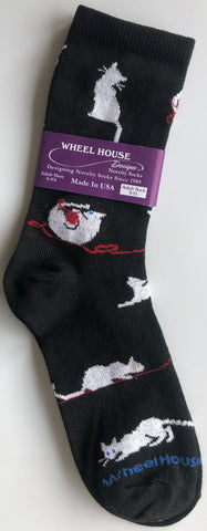 black crew sock with cute white cat chasing ball of red yarn all around the sock, nice detail where you can see the whiskers and cats with different coloured eyes