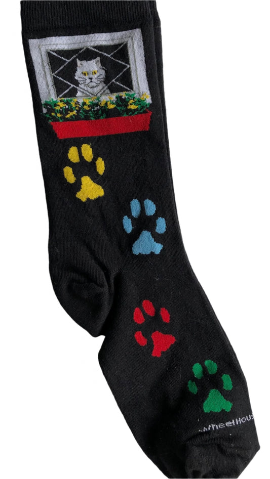 bestseller black crew sock with cat in window at top and 4 coloured paw prints from the ankle to toe