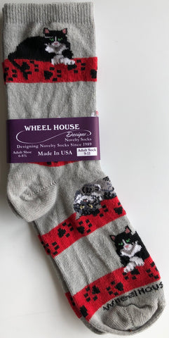 light grey crew socks with 4 horizontal red bands with black paw prints + 3 black + white cats sitting with their paws crossed, so cute!