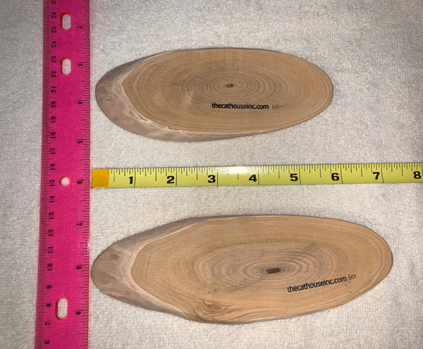 two slices of honeysuckle wood, both about 7" long, 1/2" thick but showing how different mass can be