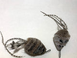 handmade cat toy mouse with short fur on body and long feather tail